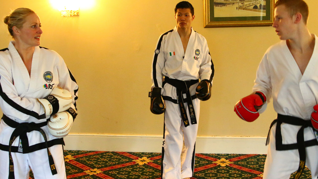 ITF Taekwon-Do practitioners working on reaction drills during a sparring training session
