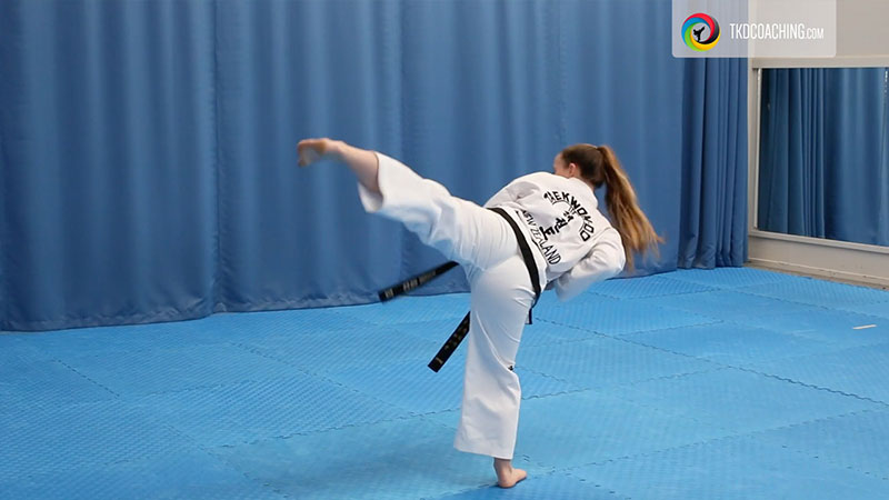 ITF Taekwon-Do practitioner performing a middle side piercing kick during the Kwang-Gae pattern