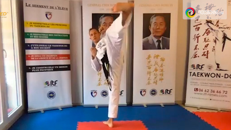 ITF Taekwon-Do legend Master Lylian Doulay performing a high kick during pattern training