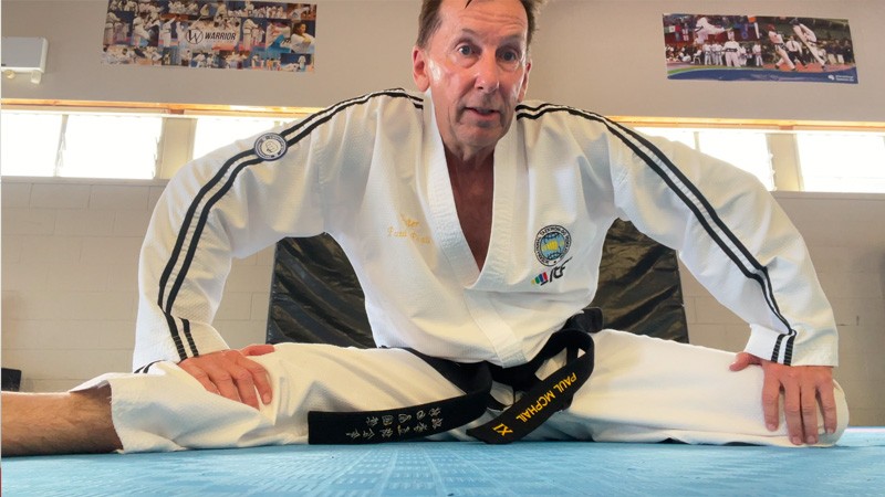 Grand Master Paul McPhail stretching during his own Taekwon-Do training session