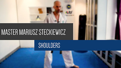 Master Mariusz Steckiewicz teaching shoulder injury prevention exercises for Taekwon-Do practitioners