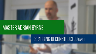 Master Adrian Byrne explaining sparring strategy during an ITF Taekwon-Do masterclass